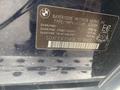 A label detailing specifications and vehicle information for a 2009 BMW X5 including GVWR and GAWR values