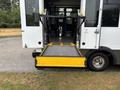 A 2020 Chevrolet Express with a lowered ramp extending from the rear doors for accessibility purposes