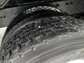 Close-up of a treaded tire on a 2011 International 4400 showing detailed patterns and surface wear
