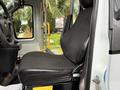 A 2019 Chevrolet Express driver's seat with black fabric upholstery and a sleek design showcasing adjustable features and sturdy construction