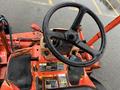 The image shows the steering wheel and control panel of a 2012 Kubota F3680 tractor with a black steering wheel and various controls and gauges visible