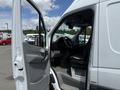 A 2016 Mercedes-Benz Sprinter van with the driver side door open showing the interior and steering wheel