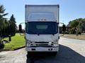 Front view of a 2019 Isuzu NRR box truck with a white exterior and large cargo area attached to the chassis
