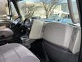 Interior view of a 2013 International Durastar 4300 showing the driver's seat dashboard and controls