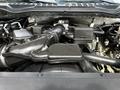 A 2020 Ford F-350 Super Duty engine bay showing the air intake system and various engine components