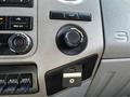 Interior dashboard controls of a 2016 Ford F-550 including air conditioning knobs and a USB port