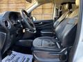 Interior of a 2022 Mercedes-Benz Metris showing front seats and steering wheel with black leather upholstery