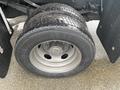 Close-up of a 2021 Ford F-550 tire showcasing the tread pattern and alloy wheel with black detailing