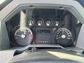 Dashboard of a 2013 Ford F-250 SD showing speedometer fuel gauge and trip information display