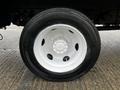 Close-up of a white steel wheel rim with hub and tire from a 2018 Hino 195 truck