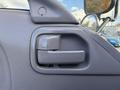 Close-up of the interior door handle of a 2007 GMC W5500 18 Foot Cube Van