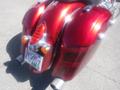 Close-up of a red 2017 Indian Chieftain Elite motorcycle showing its rear fender and chrome exhaust tips