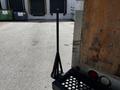 A black rubber cone-shaped traffic marker stands upright next to the rear of a truck trailer