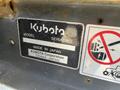 A label on a 2010 Kubota F3990 displaying the model and serial number with a warning icon and a note indicating it was made in Japan