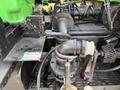 A detailed view of the hydraulic system on a 1996 Kenworth T800 showing hoses valves and a control panel with labels for pushing and pulling actions