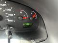 Dashboard of a 2006 Ford Econoline showing the speedometer gauge and fuel gauge with a digital odometer reading 2238011