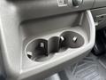 Cup holder section of a 2023 Ford Transit with two slots for beverages