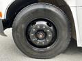 Close-up of a black tire from a 2015 Spartan School Bus showcasing the wheel with visible lug nuts and Yokohama tire branding