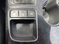 Dashboard controls of a 2015 Kia Sorento featuring buttons for power outlets eco mode and off switch