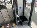 Interior view of a 2007 Freightliner B2 featuring a wheelchair lift control panel and a black storage bin on the floor