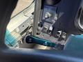 Close-up of the control panel inside a 2019 Freightliner MT45 featuring various switches and a lever marked for lift and pull functions