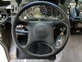 A steering wheel of a 2008 Morgan Olson Workhorse featuring gauges and controls on the dashboard with the Workhorse logo in the center