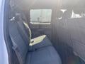 A 2017 Ford F-150 with a spacious rear seating area featuring gray fabric upholstery and seatbelts for multiple passengers