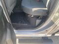 Interior side view of a 2021 RAM 1500 truck showing the driver's seat floor area and step pad