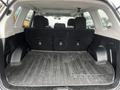 The trunk of a 2016 Subaru Forester featuring a rubber mat and two rear seats in an upright position