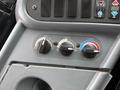 The dashboard controls of a 2016 International CE300 include knobs for air circulation heat and temperature settings