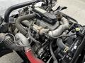 Engine components of a 2018 Hino 195 including pipes hoses and metal parts arranged in a complex configuration