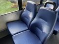 A pair of blue upholstered seats with a textured pattern designed for a vehicle interior