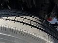 Close-up of a 2017 Isuzu NQR tire showing detailed tread patterns and grooves