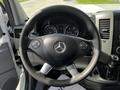 Steering wheel of a 2017 Mercedes-Benz Sprinter with controls and dashboard visible behind it