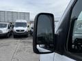 A 2016 Mercedes-Benz Sprinter showing the right side mirror with a clear reflection of the surrounding vehicles