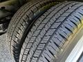 Close-up of two tires from a 2021 Ford Econoline showcasing their tread patterns and rubber texture