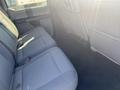 Interior view of the back seat of a 2017 Ford F-150 with gray fabric upholstery and spacious seating area