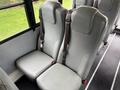 Two gray passenger seats with seatbelts designed for a 2016 International CE300 bus