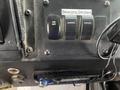 Dashboard controls of a 2012 Workhorse W62 with labeled switches for beacons and strobes along with a radio interface