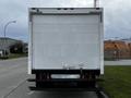 A white 2013 Hino 195 box truck viewed from the rear with a smooth surface and metallic bumper at the bottom