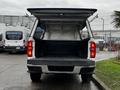 A 2018 Chevrolet Colorado pickup truck with the tailgate down displaying the open truck bed