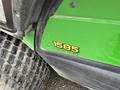 2014 John Deere 1585 TerrainCut logo on a green mower with a textured tire in the foreground