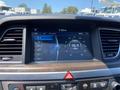 Dashboard display of a 2017 Genesis G80 showing radio stations and time