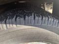 Close-up of a tire from a 2018 Chevrolet Express showing a deep tread pattern and a clean surface