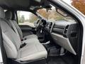 Interior view of a 2020 Ford F-350 SD showing front seats and dashboard with gray fabric upholstery and a simple layout