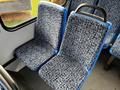 Two blue and gray patterned seats in a vehicle interior