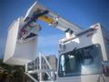 A 2006 Freightliner FS65 bucket truck featuring an extended boom and bucket for elevating personnel or equipment