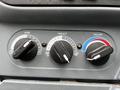 Control knobs for air conditioning and heating system on a 2013 International 4200 dashboard