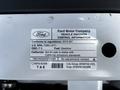 A 2010 Ford Ranger vehicle emission control information label detailing regulations and specifications for the vehicle