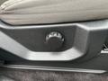 Close-up of a seat adjustment knob in a 2016 Ford F-150 interior with a textured surface and a circular design